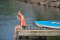 Cute young blonde woman - kayaking at lake Royalty Free Stock Photo