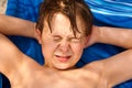 Cute young boy at the beach closes Royalty Free Stock Photo