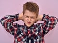 Cute young boy covering his ears with hands Royalty Free Stock Photo