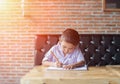 Cute young boy doing homework Royalty Free Stock Photo