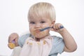 Cute young boy eating with messy face Royalty Free Stock Photo