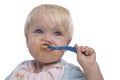Cute young boy eating with messy face Royalty Free Stock Photo