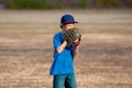 Cute young boy playing baseball outdoors Royalty Free Stock Photo