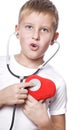 Cute young boy playing doctor