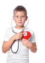 Cute young boy playing doctor