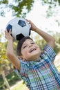 Sporty Young Boy Playing with Soccer Ball Outdoors in the Park. Royalty Free Stock Photo