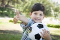Cute Young Boy Playing with Soccer Ball in Park Royalty Free Stock Photo