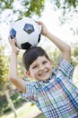 Cute Young Boy Playing with Soccer Ball in Park Royalty Free Stock Photo