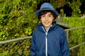 Cute young boy standing in a park in Singapore Royalty Free Stock Photo