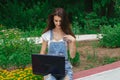 Cute young brunette girl using a laptop Royalty Free Stock Photo