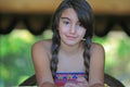 Cute young brunette girl by the window