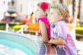 Cute Young Caucasian Brother and Sister Enjoying a Fountain At