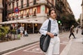 Cute young caucasian woman posing looking at camera spending time outdoors. Royalty Free Stock Photo