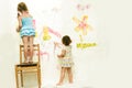 Cute young child girls painting over white Royalty Free Stock Photo