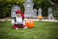 Cute young child in a halloween costume ready to trick or treat