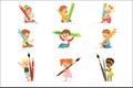 Cute young children holding big pencils, pens and paintbrushes, set for label design. Education and child development