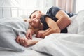 Cute young couple lying down on the bed and sleeping together Royalty Free Stock Photo