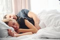 Cute young couple lying down on the bed and sleeping together Royalty Free Stock Photo