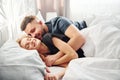 Cute young couple lying down on the bed and sleeping together Royalty Free Stock Photo