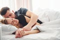 Cute young couple lying down on the bed and sleeping together Royalty Free Stock Photo