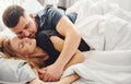 Cute young couple lying down on the bed and sleeping together Royalty Free Stock Photo