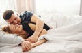 Cute young couple lying down on the bed and sleeping together Royalty Free Stock Photo