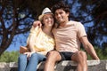 cute young couple sitting at park on bench Royalty Free Stock Photo