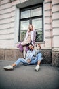 Cute young couple of teenagers girlfriends having fun, traveling europe, modern fashion citylife, lifestyle people