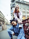 Cute young couple of teenagers girlfriends having fun, traveling europe, modern fashion citylife, lifestyle people