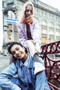 Cute young couple of teenagers girlfriends having fun, traveling europe, modern fashion citylife, lifestyle people