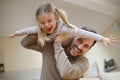 Young dad with cute daughter at home.