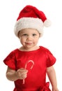 Cute young female child with a holiday candy cane