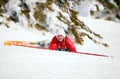 Cute young female skier after falling down Royalty Free Stock Photo