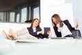 Cute young female workers are resting in office Royalty Free Stock Photo