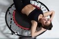 Cute young fitness-girl on rebounder