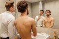 Cute young gay couple spend their morning together in bathroom Royalty Free Stock Photo