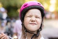 Cute young girl in helmet making funny face Royalty Free Stock Photo