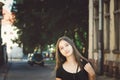 Cute young girl without makeup on the background of a beautiful old building Royalty Free Stock Photo