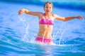 Cute young girl playing in the sea. Happy pre-teen girl enjoys summer water and holidays in holiday destinations Royalty Free Stock Photo