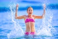 Cute young girl playing in the sea. Happy pre-teen girl enjoys summer water and holidays in holiday destinations Royalty Free Stock Photo