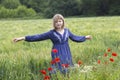 Cute young girl in poppy field Royalty Free Stock Photo