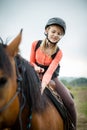 Young girl riding a horse Royalty Free Stock Photo