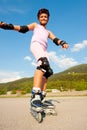 Cute young girl rollerskates on a playground Royalty Free Stock Photo