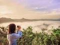 Cute young girl 25s to 35s with her camera enjoy see and take Royalty Free Stock Photo