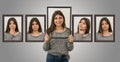 Cute young girl shows various facial expressions as if she were inside a picture. Concept of different emotions