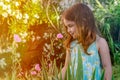 Cute Young Girl Smelling Flowers Royalty Free Stock Photo