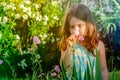 Cute Young Girl Smelling Flowers Royalty Free Stock Photo