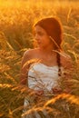 Cute young girl in a summer meadow Royalty Free Stock Photo