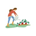 Cute young girl is use watering can to wet radish Royalty Free Stock Photo
