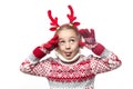 Cute young girl wearing deer horns. New year concept. Royalty Free Stock Photo